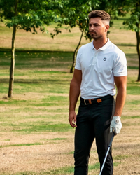 Block Polo Shirt in white, worn on the course