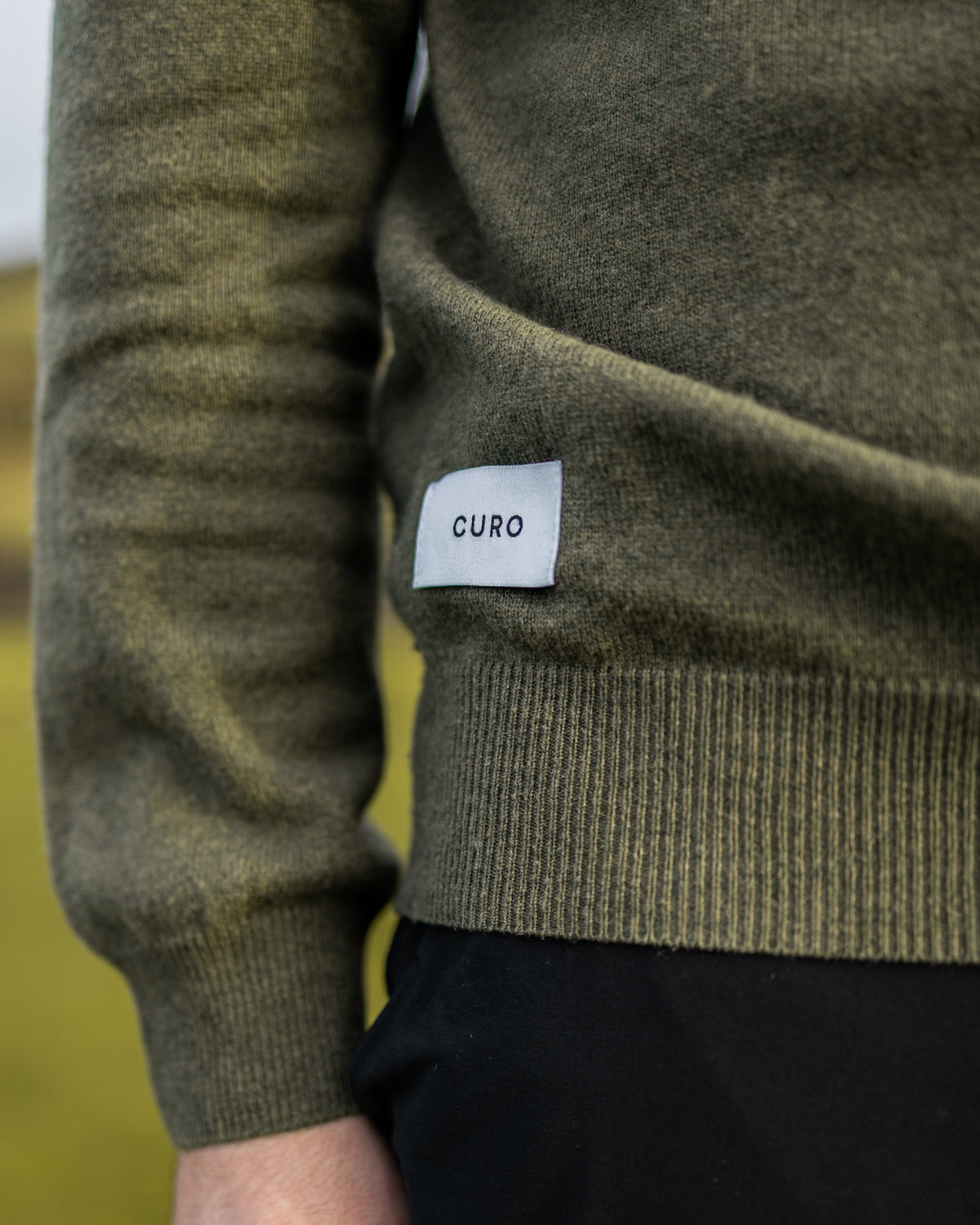 Merino Haven Hoodie knit and hem label detail in green