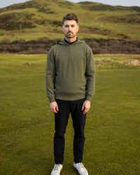 Merino Haven Hoodie in green, full length on the course