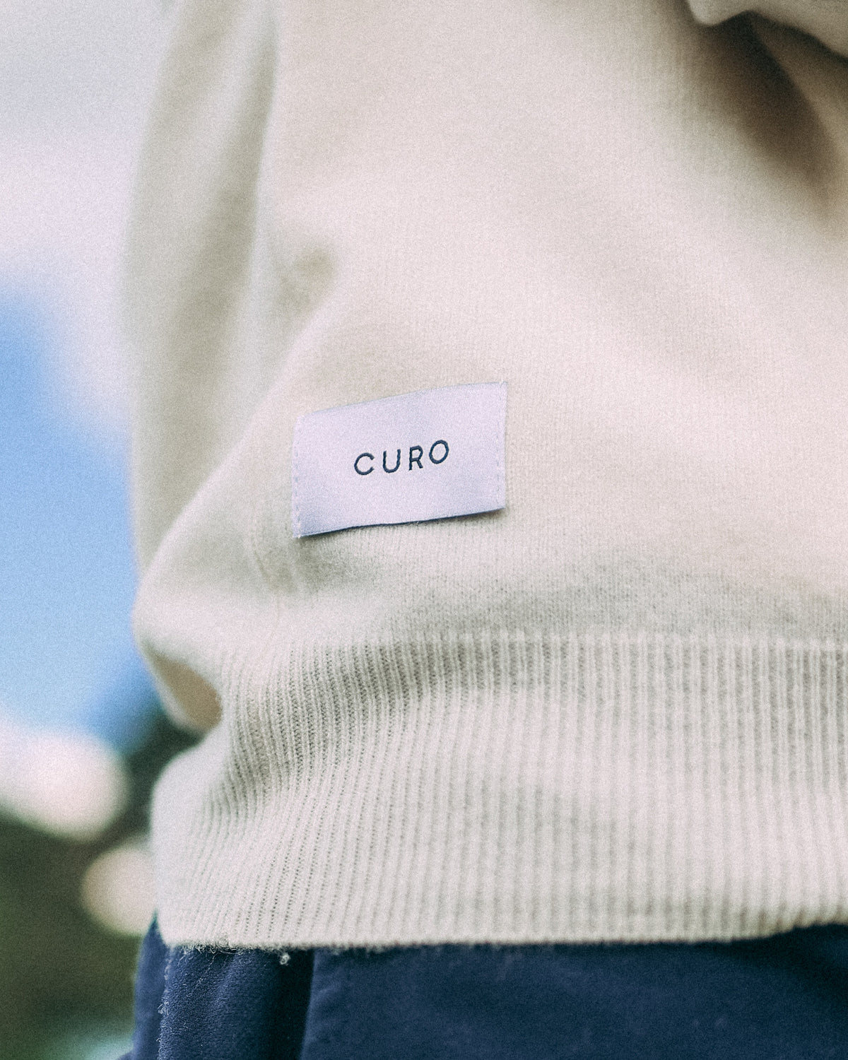 Merino Haven Hoodie label and knit detail in cream
