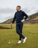 Merino Haven Hoodie in navy, standing on the course