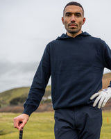Merino Haven Hoodie in navy, close-up on the course