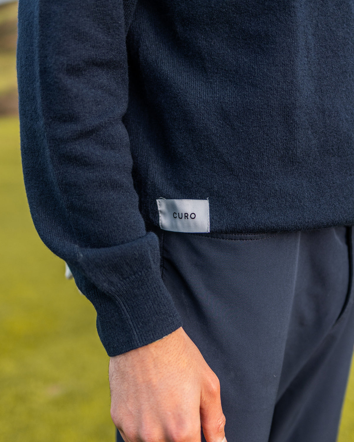 Merino Haven Hoodie knit and hem label detail in navy