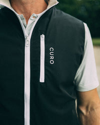 Revere Reversible Gilet in black, chest pocket detail