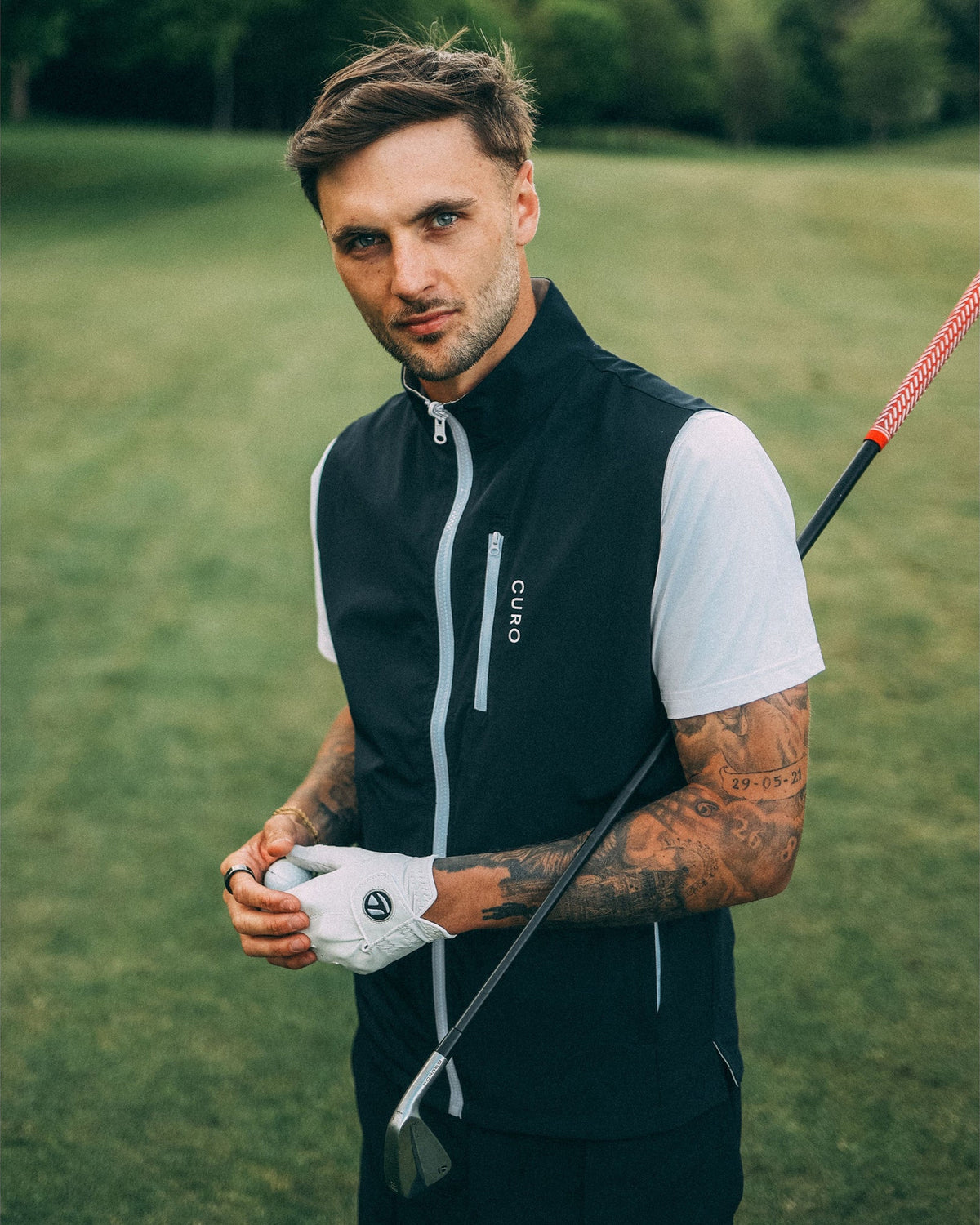 Revere Reversible Gilet in navy, worn on the course