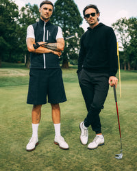 Revere Reversible Gilet in navy, worn on the course with friends